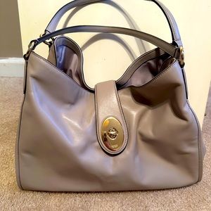 Like new- barely used Coach three pocket bag!